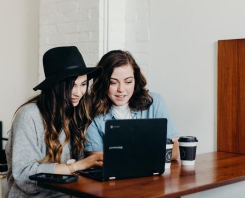 Two girls searching for jobs online